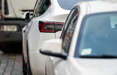 Image of two cars parked on the roadside, representing options for car parking training in Guwahati.