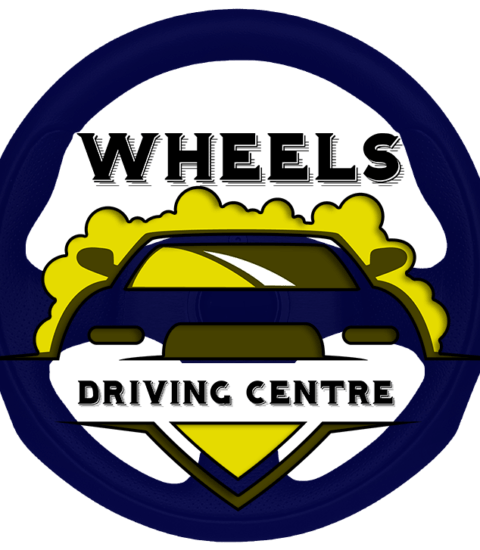 Exterior view of WHEELS DRIVING TRAINING CENTRE, located in Guwahati, Assam, showcasing a welcoming entrance and signage.