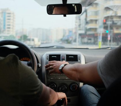 two person riding vehicle during daytime